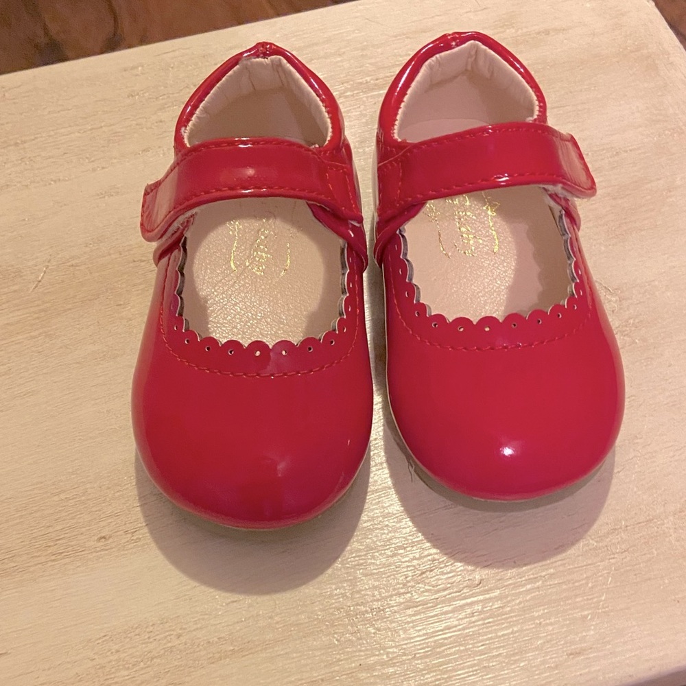 Shiny red toddler shoes